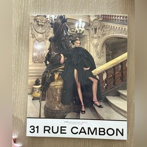 CHANEL Black Dress with Dramatic Silhouette